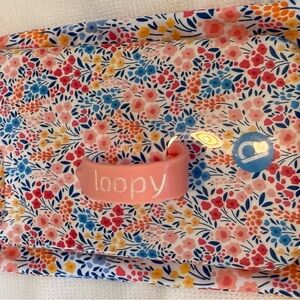 Loopy Cases; fits iPhone 13 Pro; small flowers pink, blue iridescent
